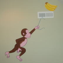 Curious George swinging from the vent.