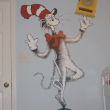 The Cat in the Hat balancing an actual clock.